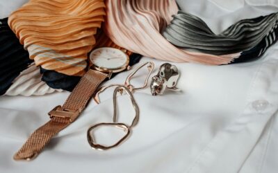 round white and gold-colored analog watch with gold-colored milanese band