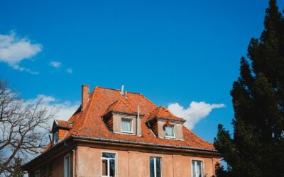 Orange building with red roof under blue sky
